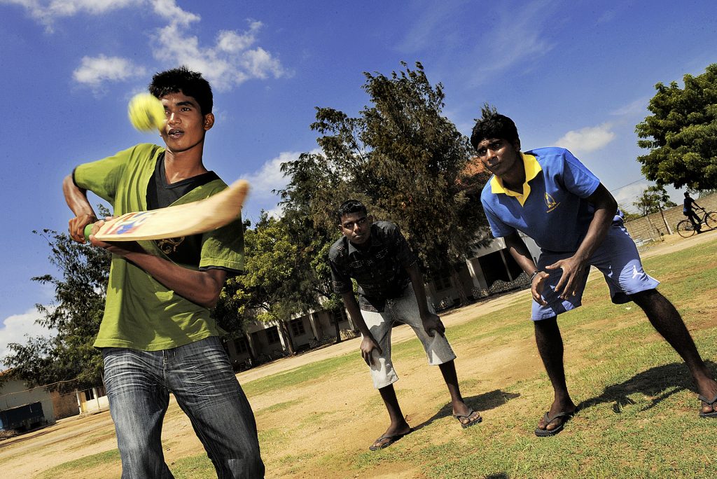 After school some boys from the former LTTE / Tamil Tigers rebel army play cricket in the Don Bosco facility in Mannar.